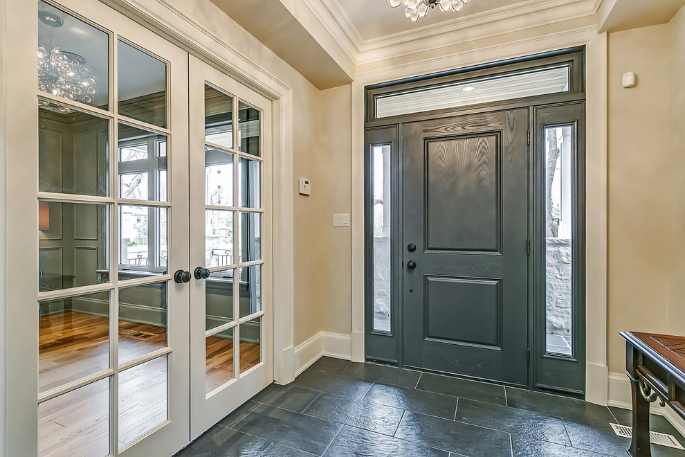 Inspiration for a mid-sized transitional foyer in Toronto with beige walls, slate floors, a single front door, a gray front door and grey floor.