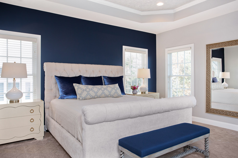 Transitional master bedroom in DC Metro with blue walls.