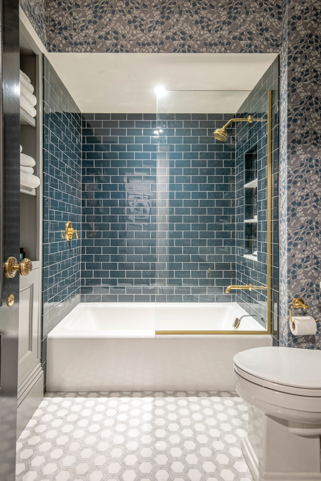 This is an example of a transitional bathroom in Boston with blue tile, ceramic tile, multi-coloured floor, an open shower, a niche and wallpaper.