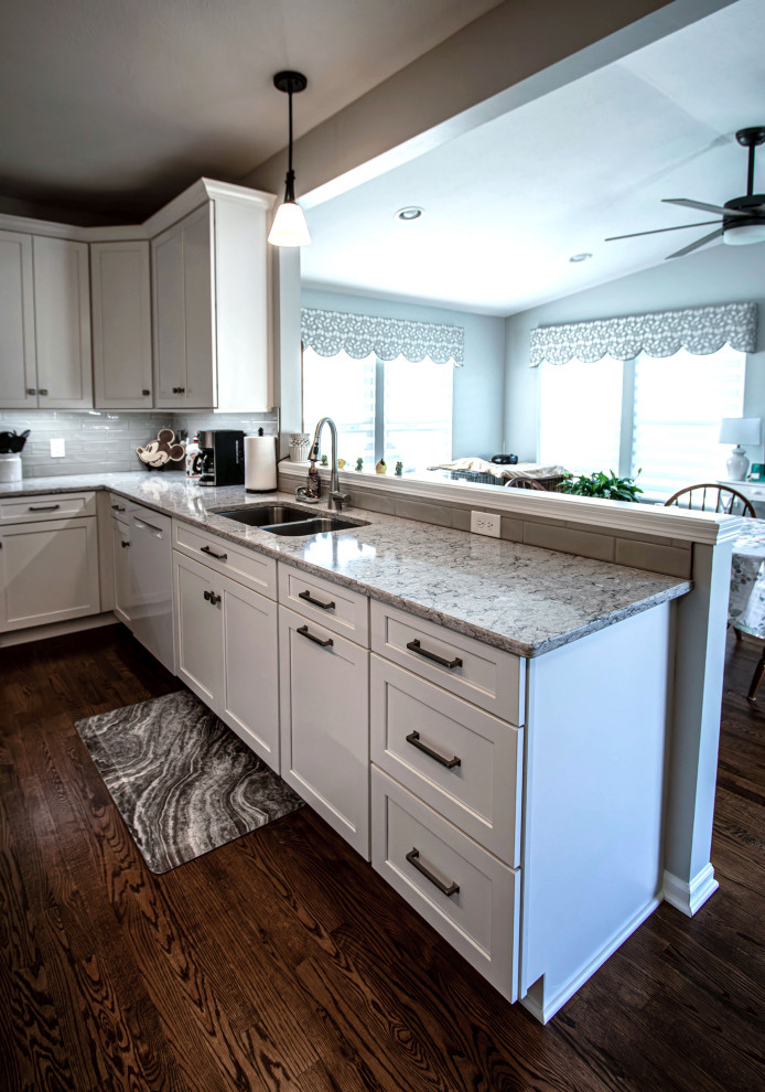 White Shaker Kitchen w/ Pietra Quartz Countertops & Gray Subway Tile