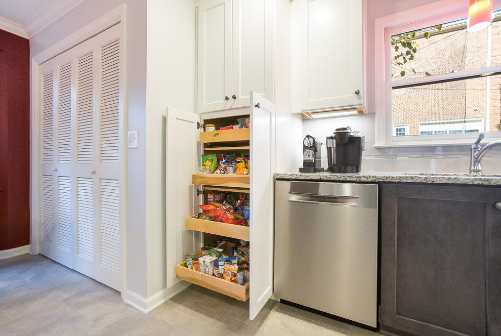 Inspiration for a mid-sized transitional u-shaped porcelain tile enclosed kitchen remodel in Birmingham with a double-bowl sink, shaker cabinets, granite countertops, gray backsplash, ceramic backsplash, stainless steel appliances and no island