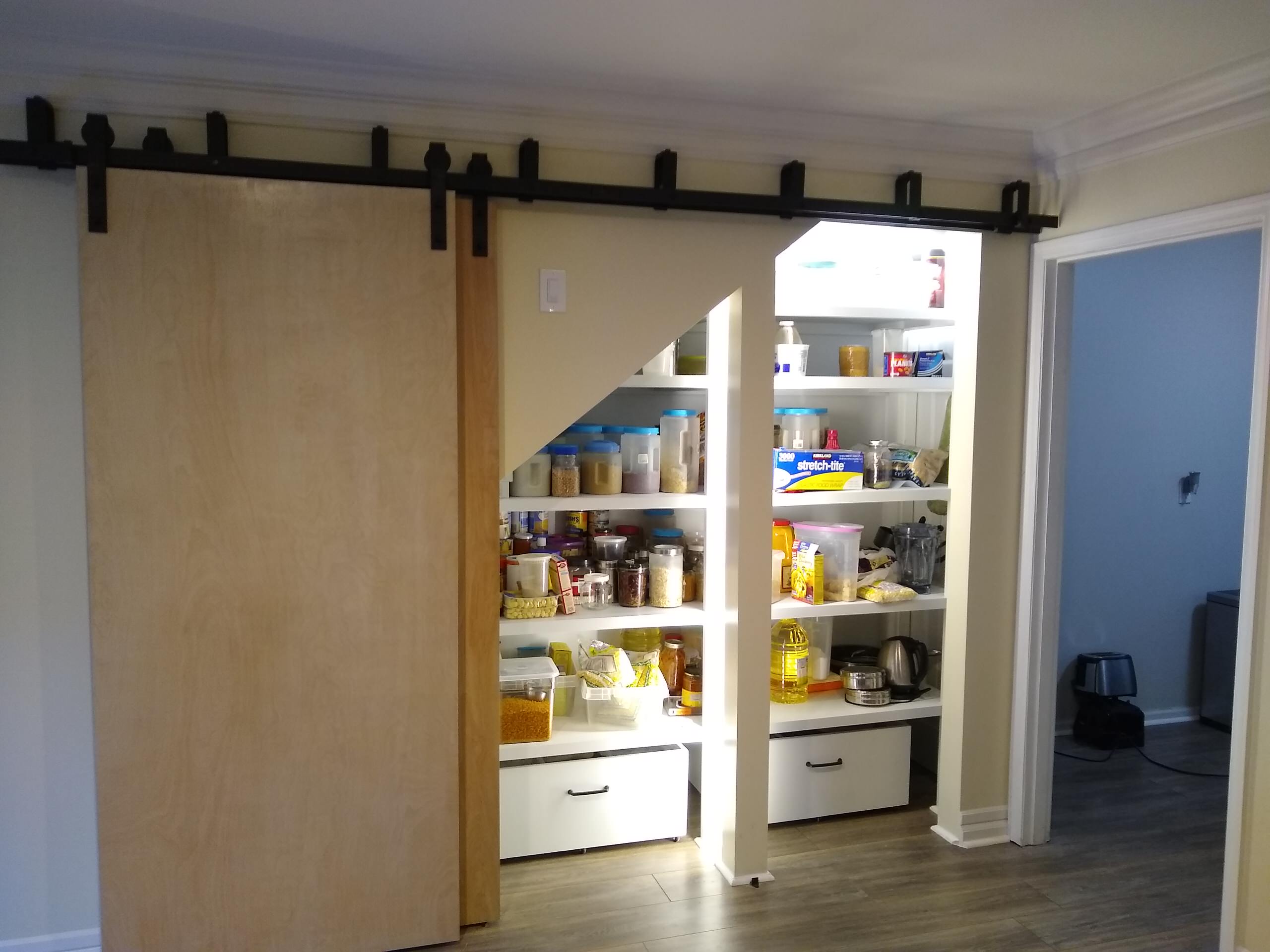 Build Closet with Sliding Barn Doors Under Stairway
