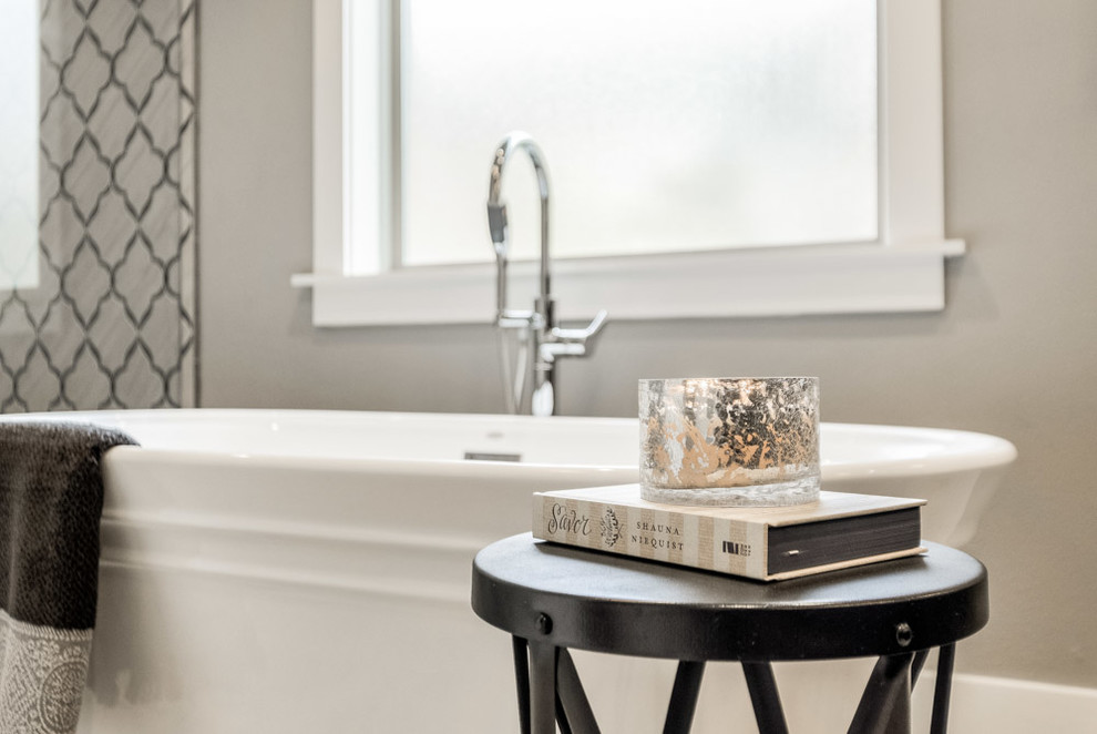 Inspiration for a mid-sized transitional master gray tile and porcelain tile ceramic tile and beige floor home design remodel with recessed-panel cabinets, dark wood cabinets, a one-piece toilet, gray walls and quartz countertops