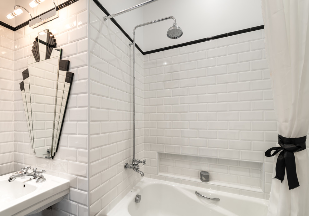 Photo of a small contemporary master bathroom in Other with a pedestal sink, a drop-in tub, a shower/bathtub combo, a two-piece toilet, white tile, subway tile and white walls.