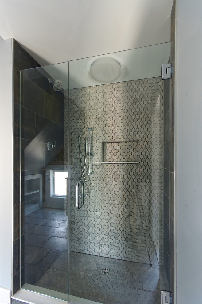 Photo of a small industrial bathroom in Baltimore with an alcove shower, gray tile, ceramic tile, grey walls, porcelain floors, an undermount sink, grey floor and a hinged shower door.