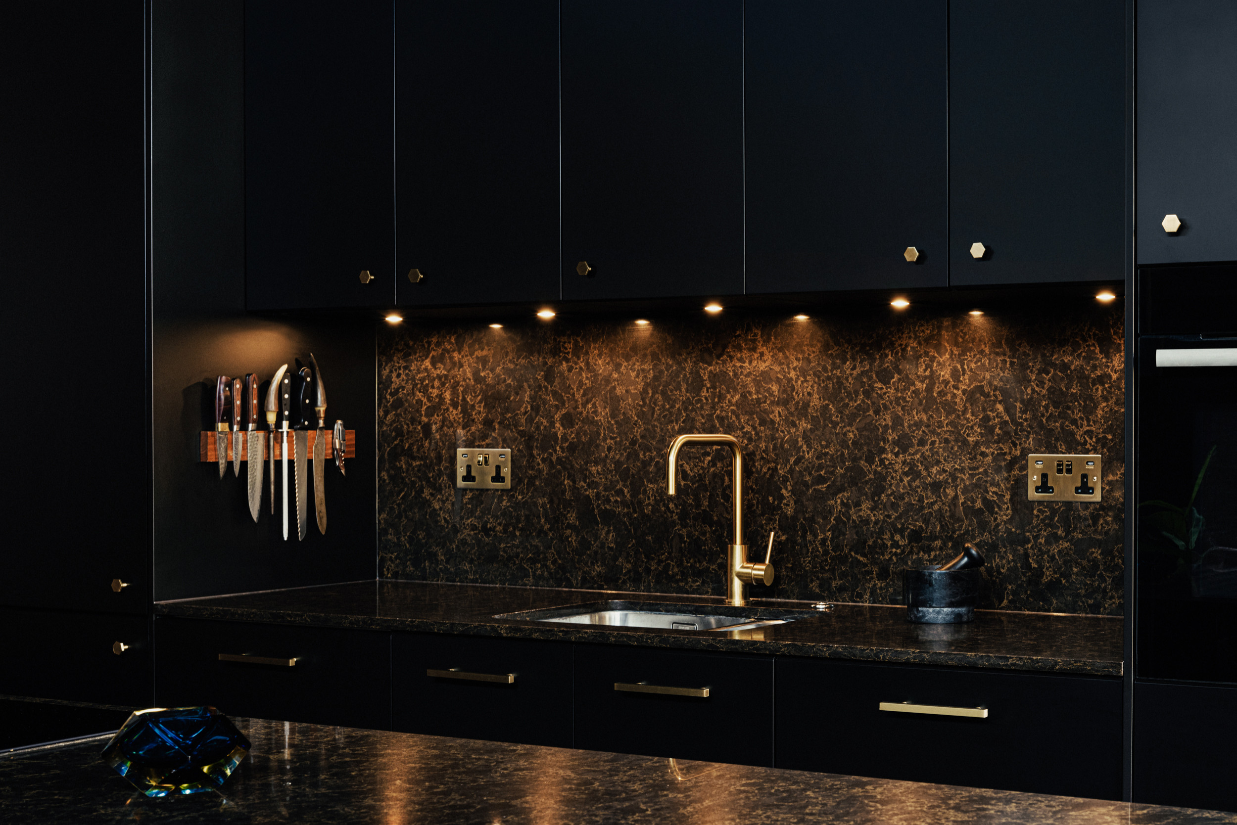 Black kitchen with Brass details