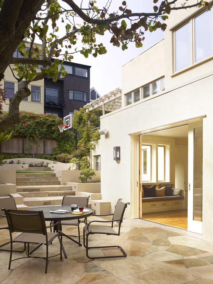 Photo of a traditional patio in San Francisco with natural stone pavers and no cover.