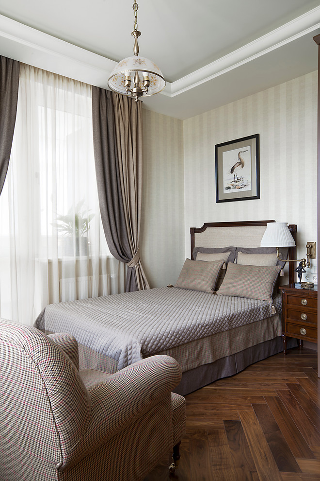 Design ideas for a traditional master bedroom in Moscow with grey walls and dark hardwood floors.