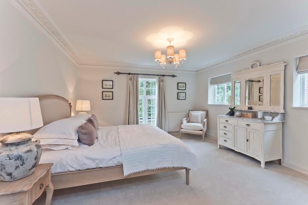 This is an example of a country bedroom in Surrey.