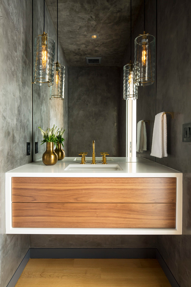 Design ideas for a contemporary powder room in Minneapolis with flat-panel cabinets, medium wood cabinets, grey walls, light hardwood floors, beige floor and white benchtops.