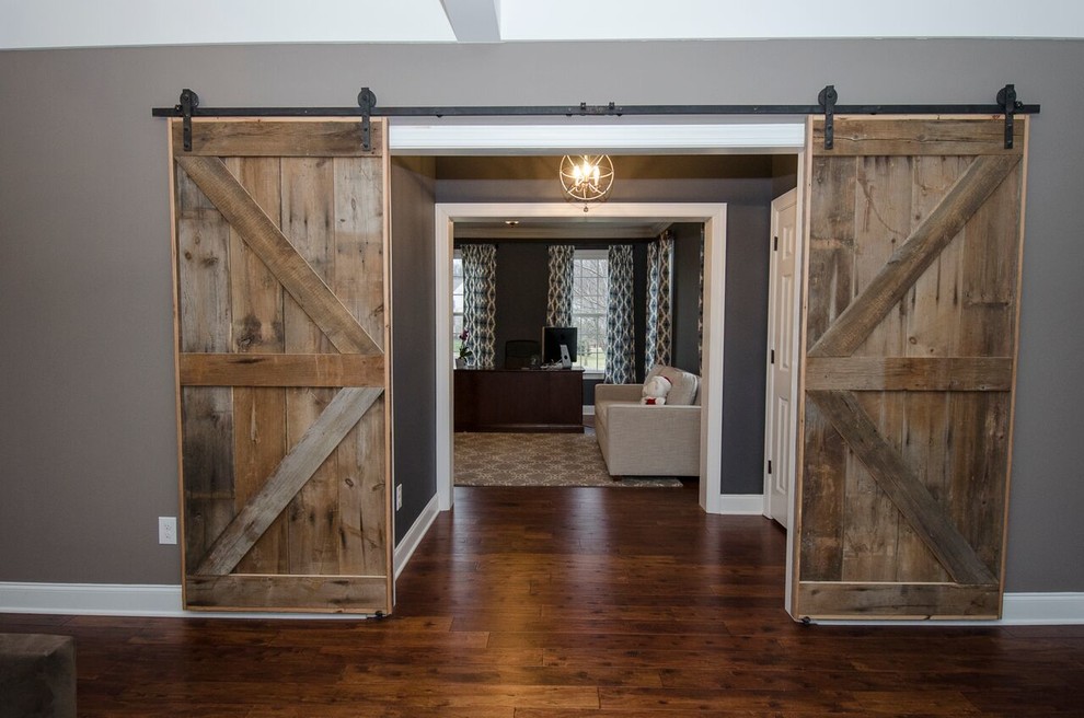 Design ideas for a mid-sized country hallway in Philadelphia with grey walls and dark hardwood floors.