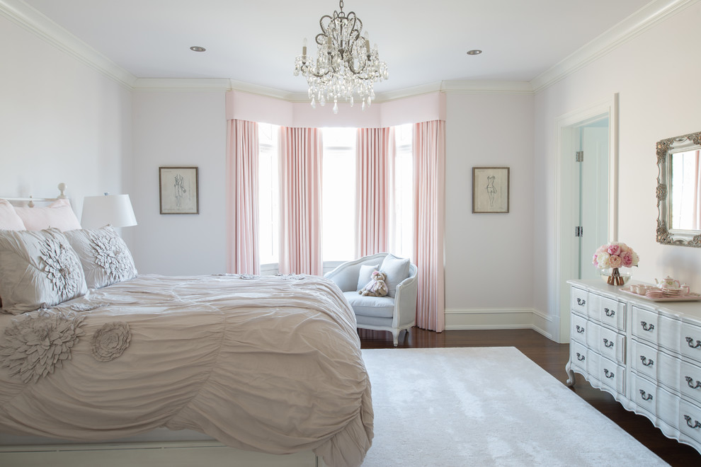 Traditional kids' bedroom in New York with dark hardwood floors and white walls for girls.