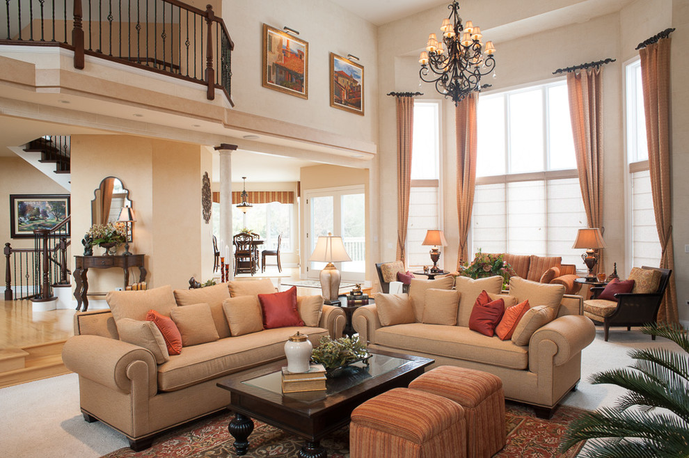 Photo of a large mediterranean open concept living room in Chicago with beige walls, carpet, a standard fireplace and a plaster fireplace surround.