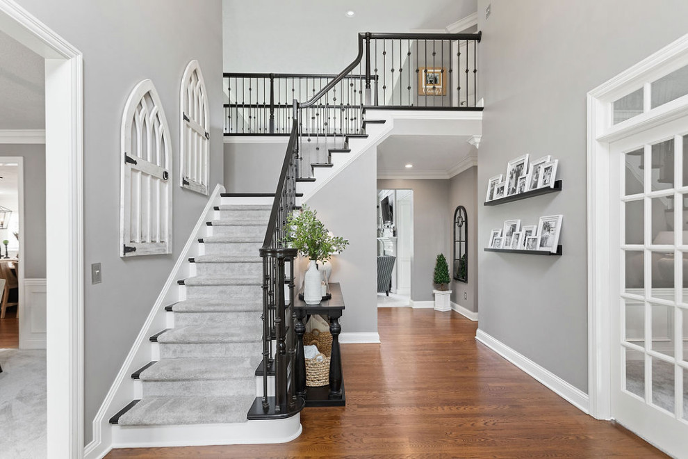Traditional wood railing staircase in Columbus.