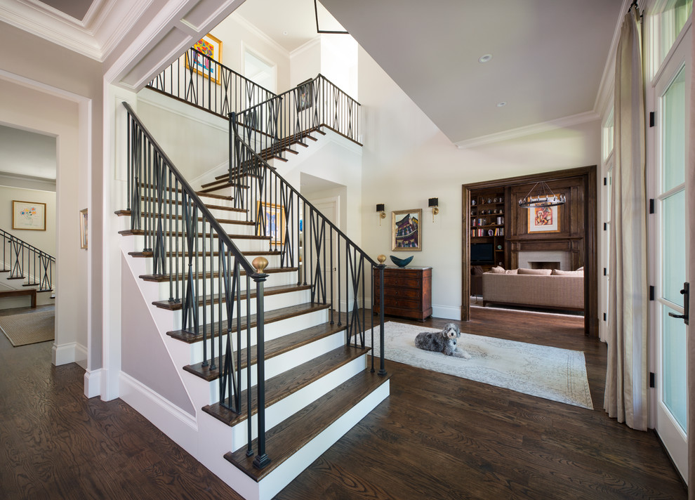 Inspiration for a large traditional foyer in Dallas with grey walls, dark hardwood floors and a double front door.