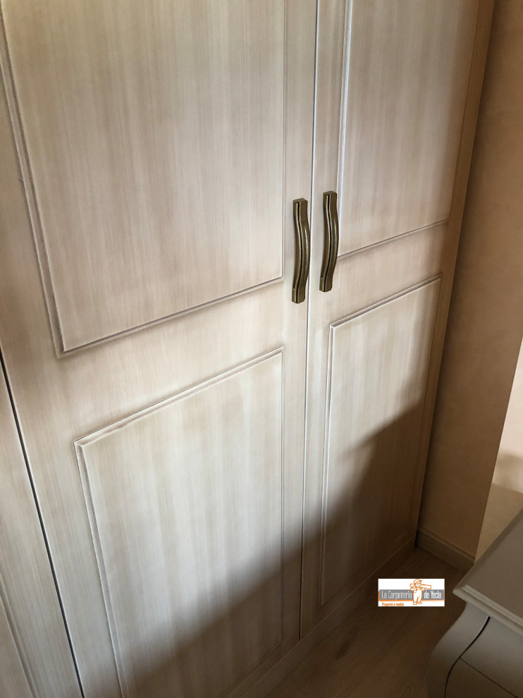 This is an example of a mid-sized contemporary gender-neutral storage and wardrobe in Alicante-Costa Blanca with beaded inset cabinets, medium wood cabinets, ceramic floors, beige floor and recessed.