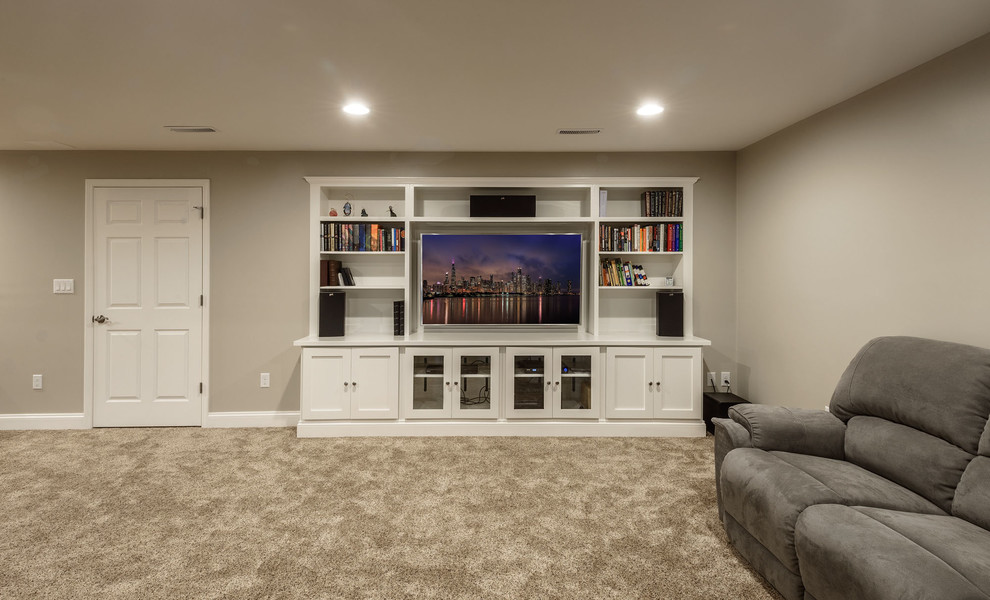 Large traditional fully buried basement in Other with grey walls, carpet and no fireplace.