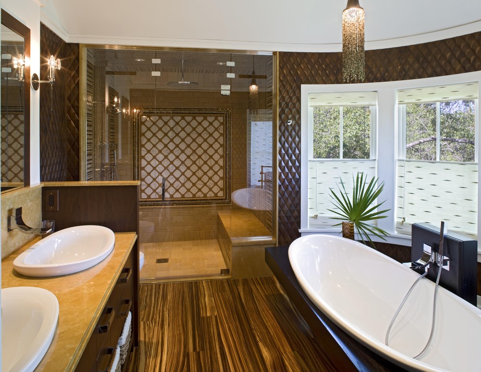 This is an example of a contemporary bathroom in Philadelphia with a vessel sink, wood-look tile and brown walls.