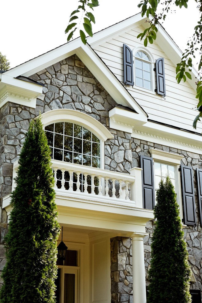 Inspiration for a large traditional two-storey grey exterior in DC Metro with mixed siding and a gable roof.
