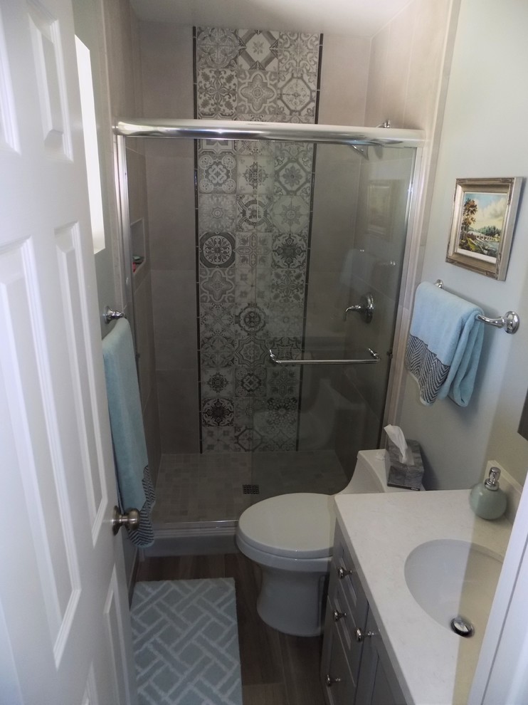 Inspiration for a small transitional master bathroom in San Diego with shaker cabinets, grey cabinets, gray tile, porcelain tile, green walls, porcelain floors and engineered quartz benchtops.