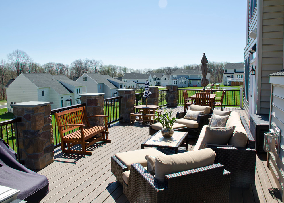 This is an example of a mid-sized traditional backyard deck in Philadelphia with no cover.