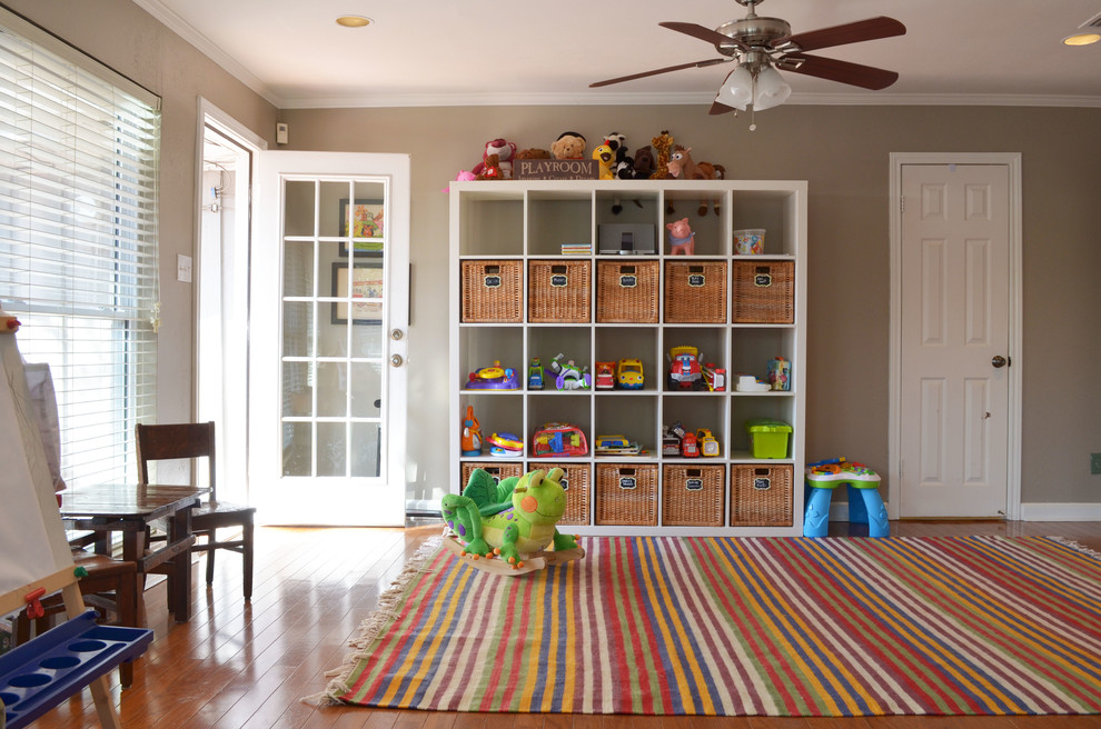 Inspiration for a traditional gender-neutral kids' room in Dallas with beige walls and medium hardwood floors.