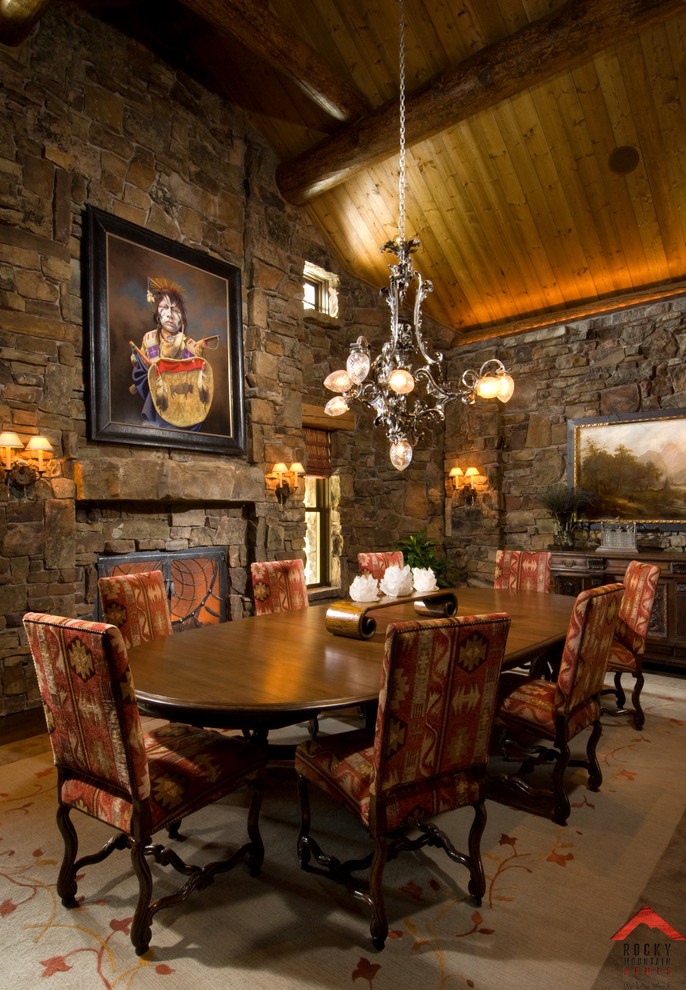Inspiration for a large country open plan dining in Other with beige walls and a stone fireplace surround.