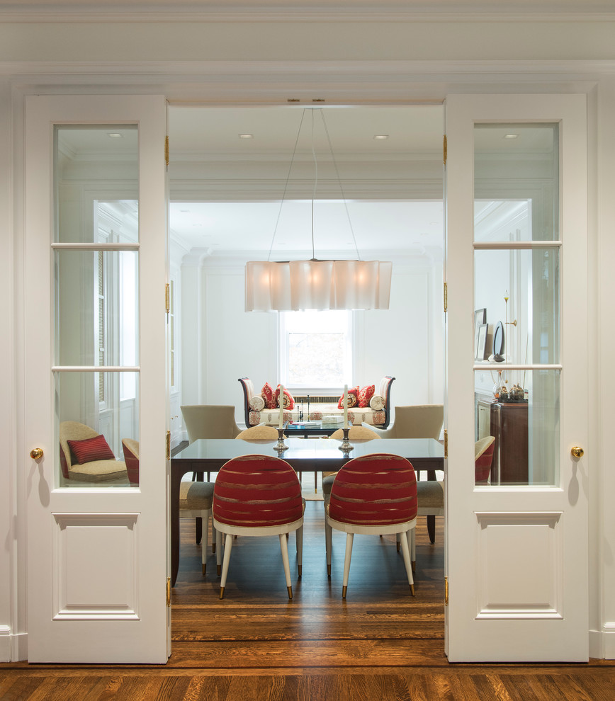 This is an example of a mid-sized transitional open plan dining in New York with white walls, dark hardwood floors and no fireplace.