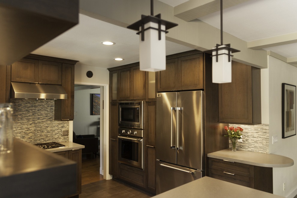 Modern Kitchen Design with Dark Wood Cabinets and Stainless Steel ...