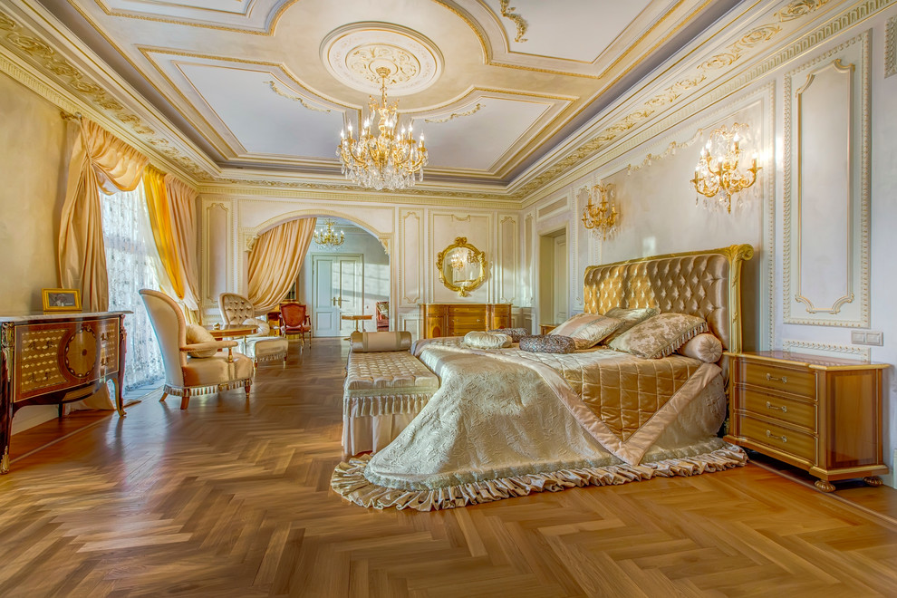 Inspiration for a traditional master bedroom in Moscow with white walls and medium hardwood floors.