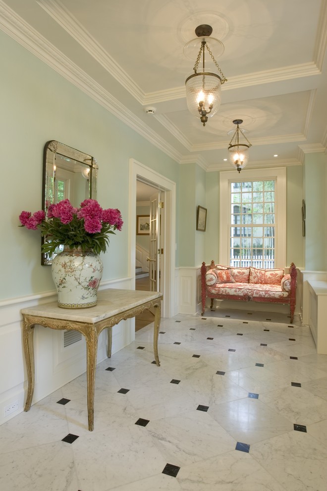 Inspiration for a traditional hallway in New York with blue walls, marble floors and multi-coloured floor.