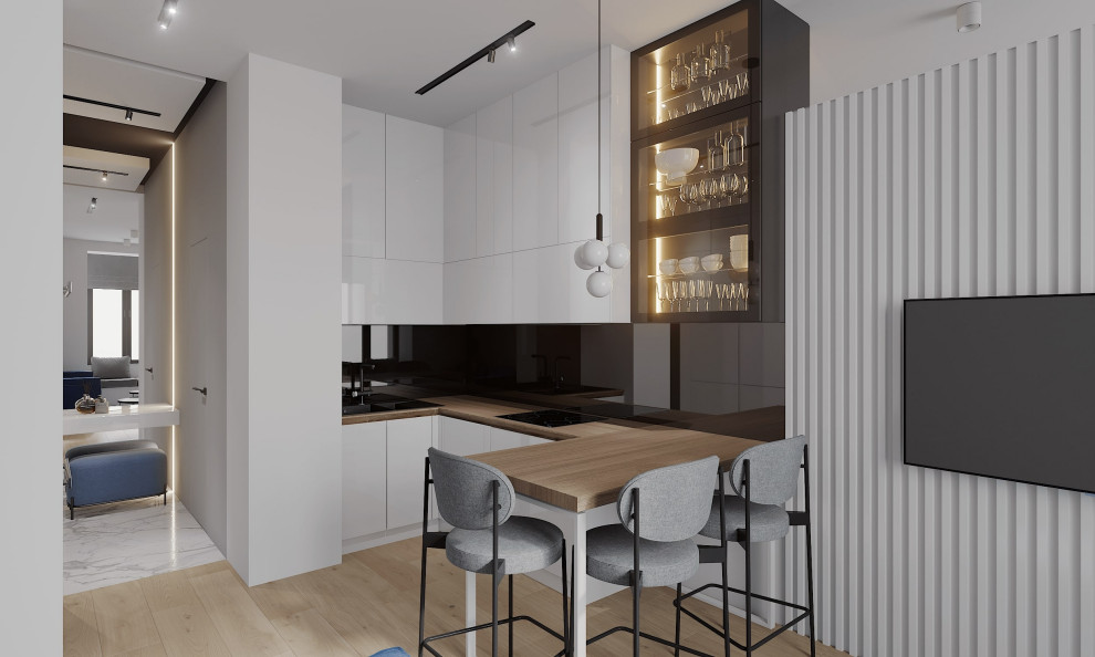 This is an example of a medium sized contemporary u-shaped open plan kitchen in Saint Petersburg with a double-bowl sink, white cabinets, wood worktops and black splashback.