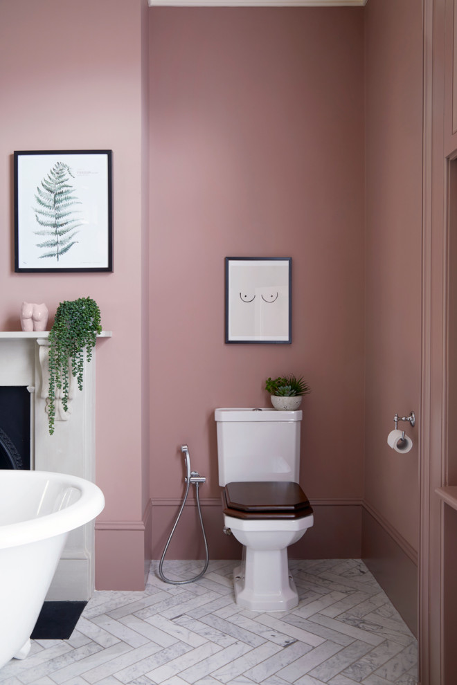 Large contemporary master bathroom in London with pink walls, marble benchtops, a double vanity, recessed-panel cabinets, a freestanding tub, an open shower, a two-piece toilet, porcelain floors, an undermount sink, grey floor, a hinged shower door, grey benchtops and a freestanding vanity.