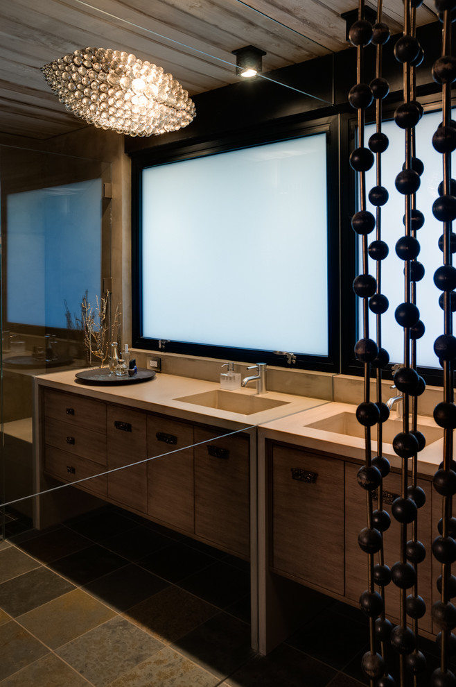 This is an example of a contemporary powder room in San Francisco with an integrated sink.