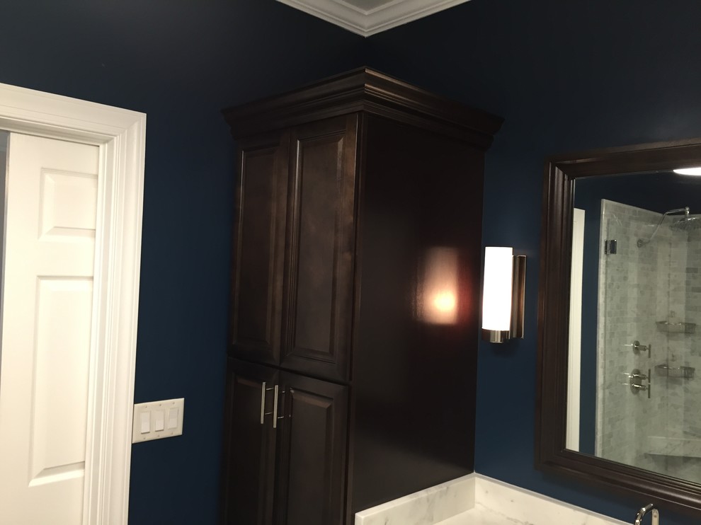 Design ideas for a large transitional master bathroom in Atlanta with an undermount sink, recessed-panel cabinets, dark wood cabinets, marble benchtops, a freestanding tub, an open shower, a one-piece toilet, gray tile, stone tile, blue walls and porcelain floors.