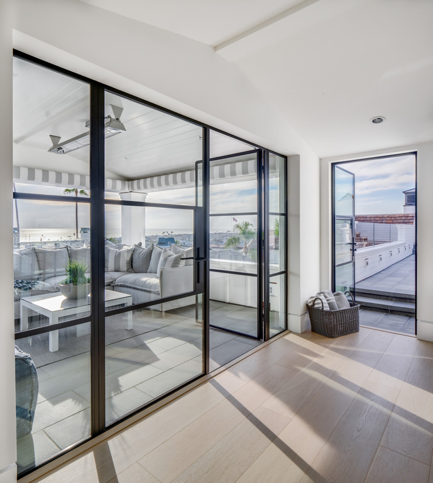 Example of a beach style home design design in Orange County