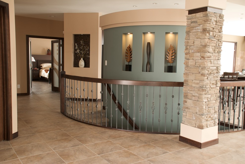 Mid-sized transitional porcelain tile and brown floor foyer photo with beige walls and a white front door