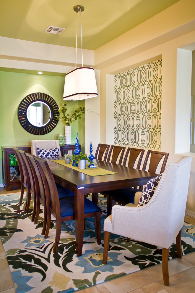 Inspiration for a mid-sized contemporary dining room in Phoenix with green walls and porcelain floors.