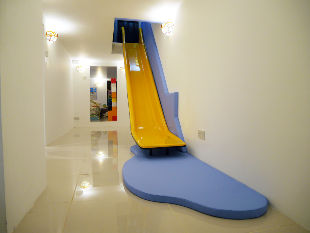 Inspiration for a mid-sized contemporary gender-neutral kids' playroom for kids 4-10 years old in Other with white walls, porcelain floors and white floor.