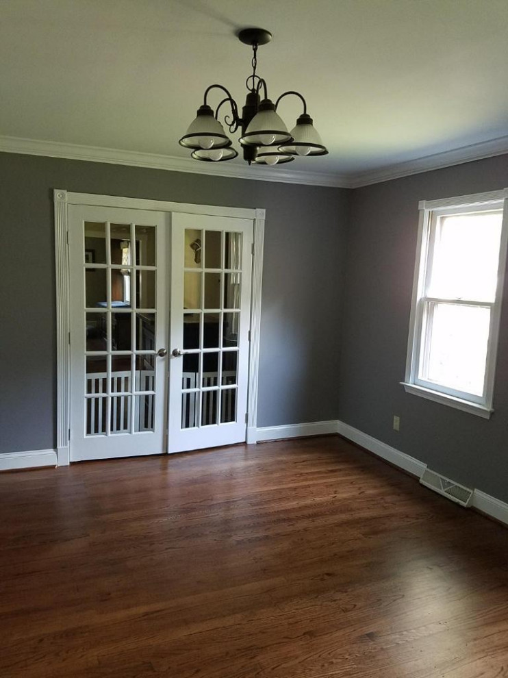 Inspiration for a large traditional master bedroom in Philadelphia with grey walls, medium hardwood floors, no fireplace, brown floor and recessed.