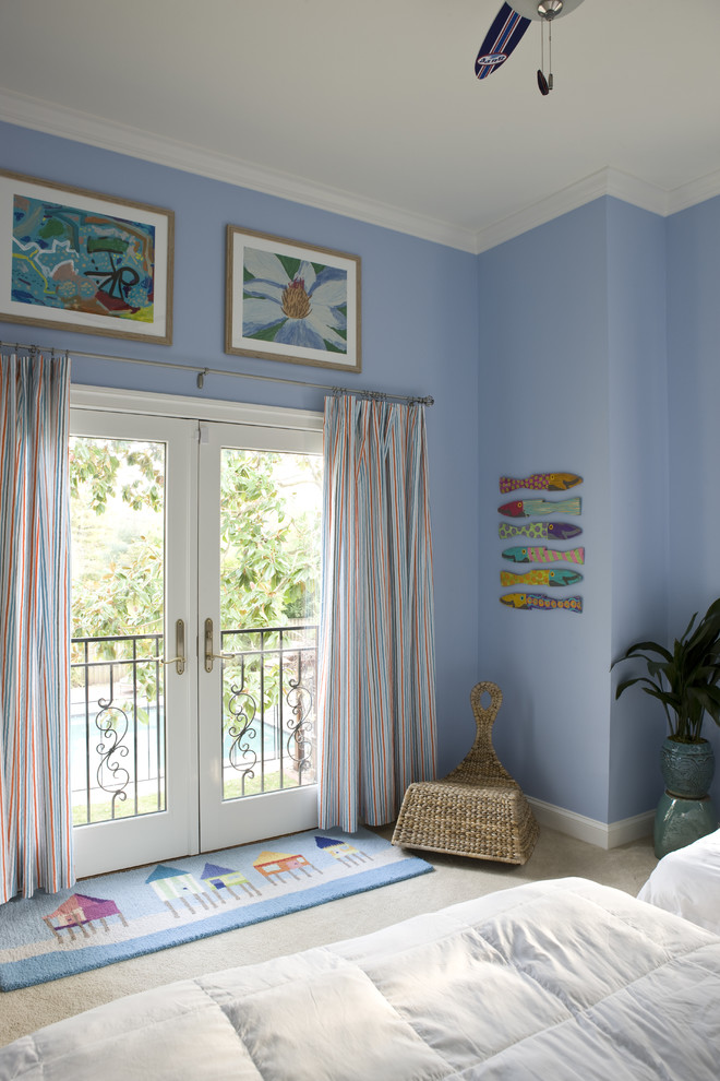 This is an example of a mid-sized beach style bedroom in DC Metro with blue walls and carpet.