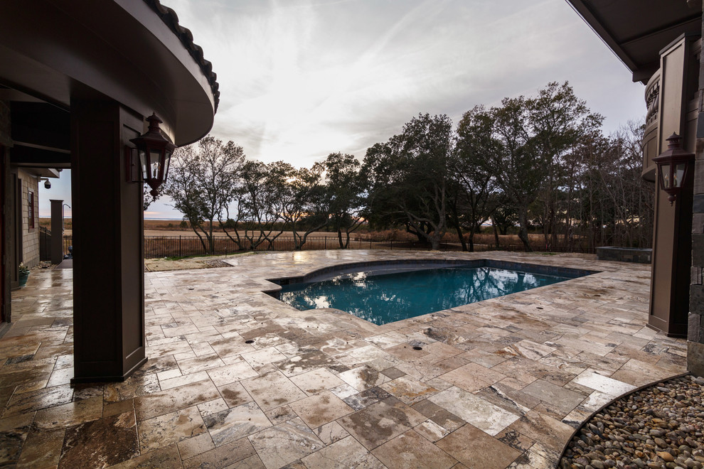 Inspiration for a mid-sized transitional backyard tile and custom-shaped natural pool remodel