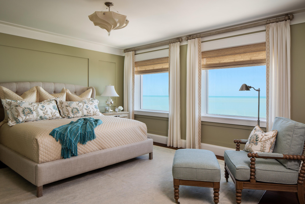 Design ideas for a large beach style master bedroom in Miami with green walls, dark hardwood floors and no fireplace.