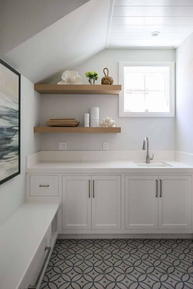 Design ideas for a beach style laundry room in Orange County.