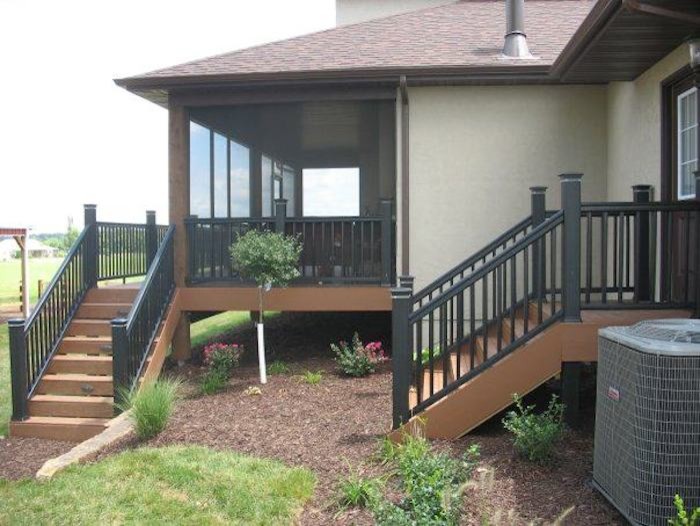This is an example of an arts and crafts backyard verandah in Other with decking and a roof extension.