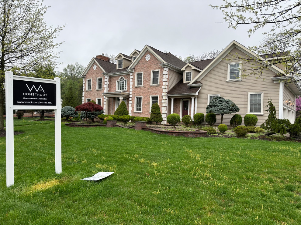 Mixed Brick & Siding Facade with Manicured Yard