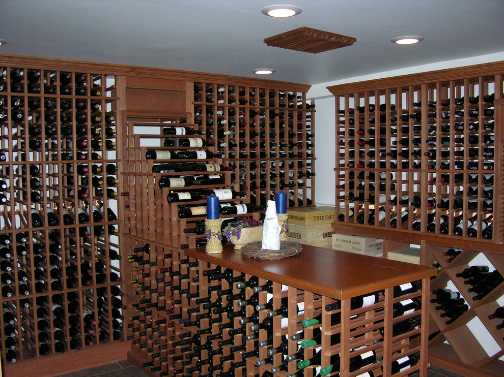 Photo of a large traditional wine cellar in Chicago with ceramic floors.