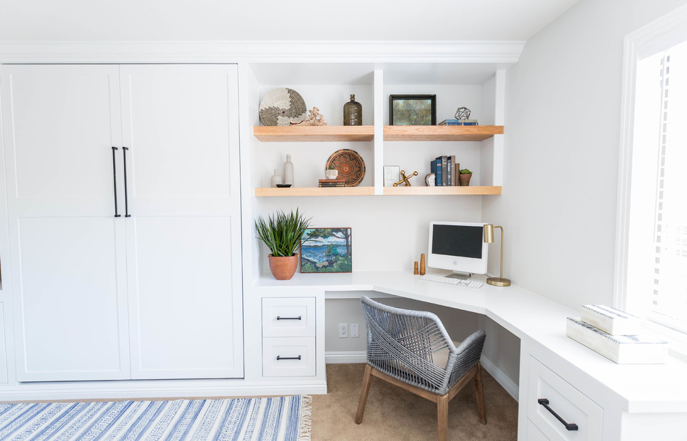 Mid-sized 1960s built-in desk carpeted and beige floor study room photo in San Diego with white walls