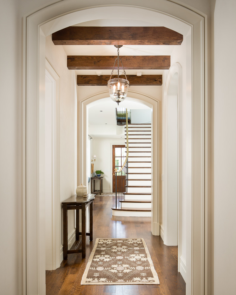 Large traditional hallway in Atlanta with beige walls and medium hardwood floors.