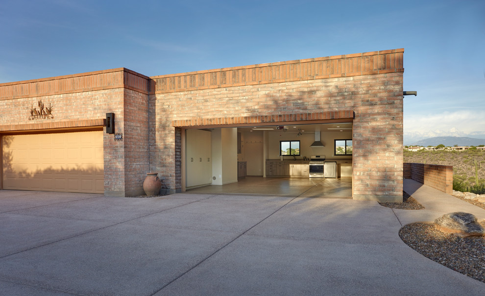 This is an example of a large transitional attached two-car garage in Phoenix.